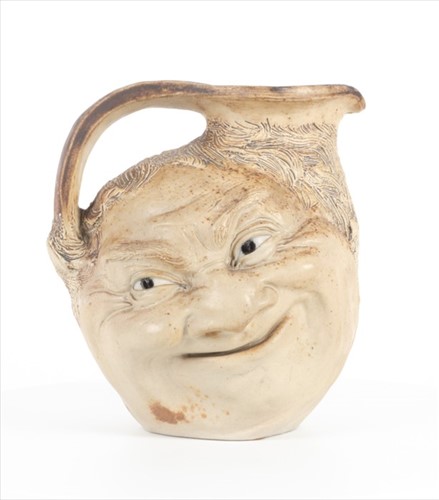 Lot 249 - A Martin Brothers large double-sided stoneware...