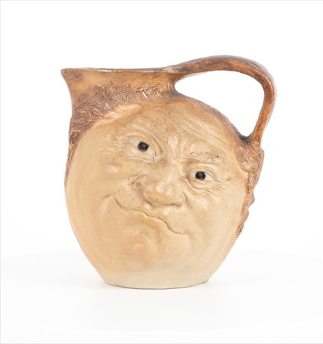 Lot 224 - A Martin Brothers double-sided stoneware face...