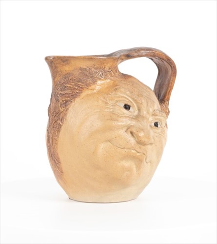 Lot 224 - A Martin Brothers double-sided stoneware face...