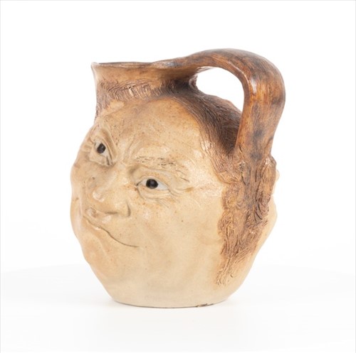 Lot 224 - A Martin Brothers double-sided stoneware face...