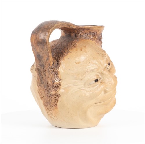 Lot 224 - A Martin Brothers double-sided stoneware face...