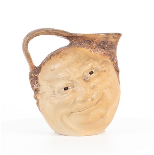 Lot 224 - A Martin Brothers double-sided stoneware face...