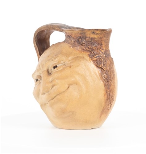 Lot 224 - A Martin Brothers double-sided stoneware face...