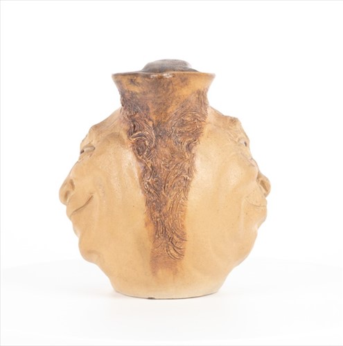 Lot 224 - A Martin Brothers double-sided stoneware face...