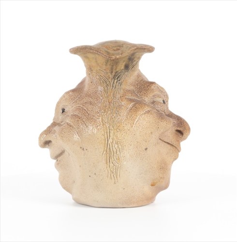 Lot 205 - A Martin Brothers double-sided stoneware face...
