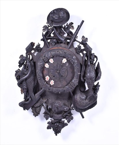 Lot 372 - A large early 20th century Black Forest carved...
