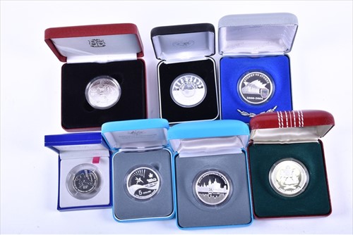 Lot 409 - A collection of seven boxed silver proof...