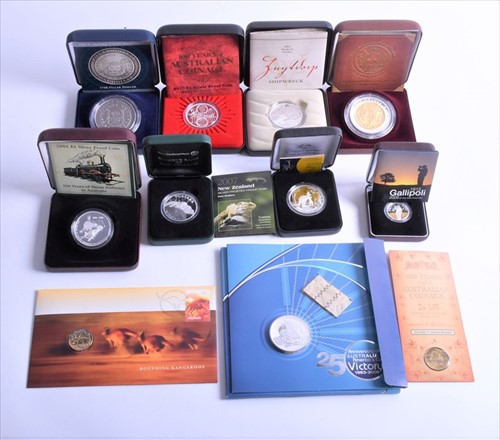 Lot 406 - A collection of nine boxed silver proof...