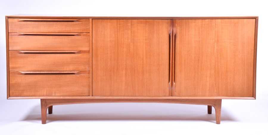 Lot 37 - A 1970s teak G-Plan style sideboard with two...