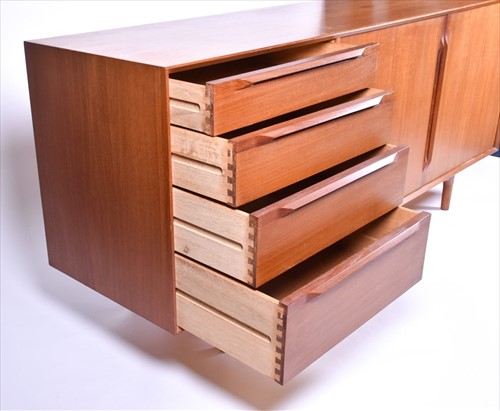 Lot 37 - A 1970s teak G-Plan style sideboard with two...
