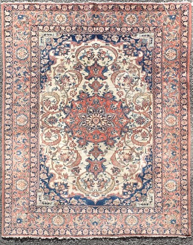 Lot 71 - A hand woven Isfahan rug with central floral...