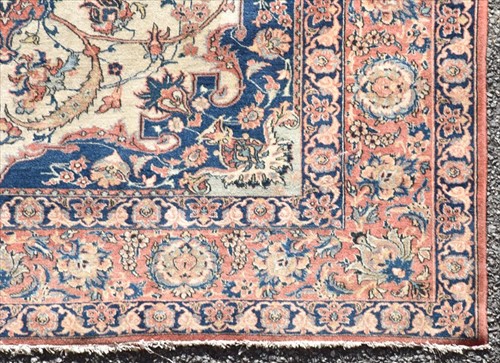 Lot 71 - A hand woven Isfahan rug with central floral...