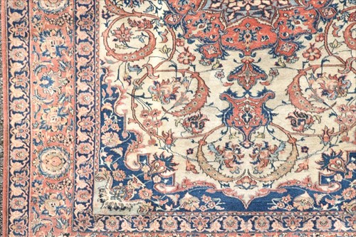 Lot 71 - A hand woven Isfahan rug with central floral...