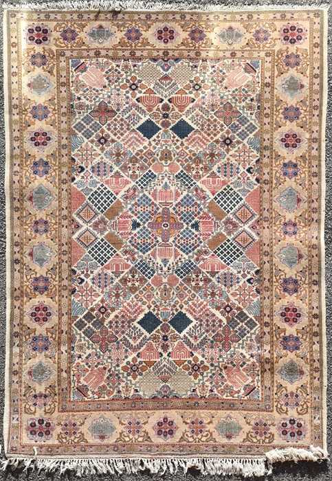 Lot 72 - A hand woven Persian Tabriz style rug of...