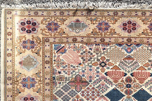 Lot 72 - A hand woven Persian Tabriz style rug of...