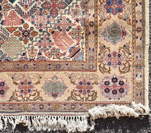 Lot 72 - A hand woven Persian Tabriz style rug of...