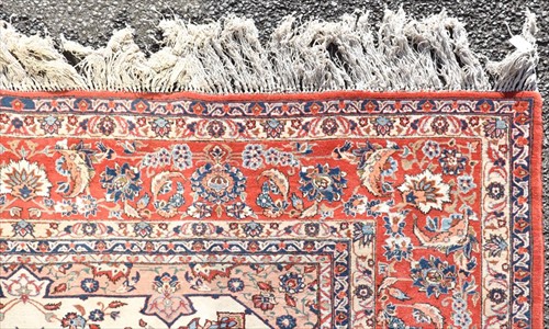 Lot 73 - A large Persian Tabriz style carpet with...