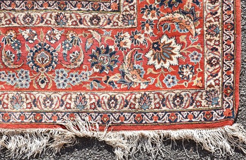 Lot 73 - A large Persian Tabriz style carpet with...