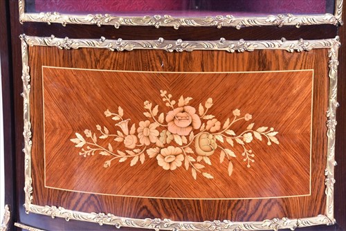 Lot 42 - A French Louis XV style corner vitrine cabinet...