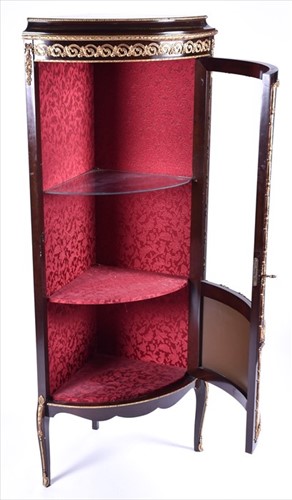 Lot 42 - A French Louis XV style corner vitrine cabinet...