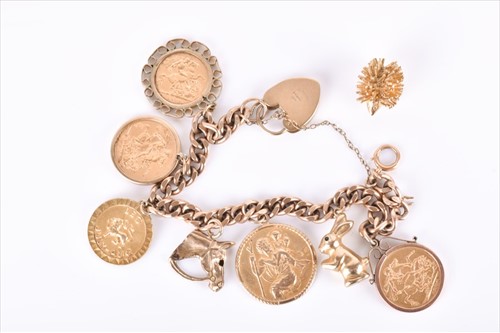 Lot 537 - A 9ct yellow gold curb-link bracelet suspended...