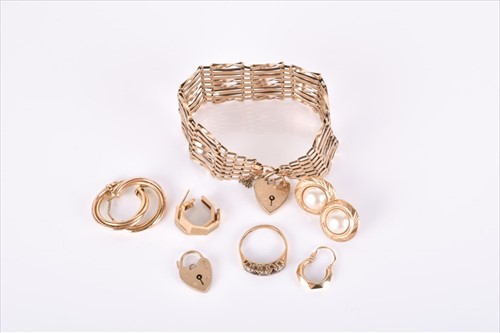 Lot 538 - A 9ct yellow gold eight-bar gate-link bracelet...