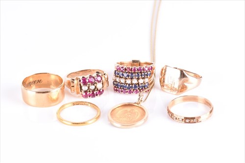 Lot 594 - A mid 20th century yellow metal, ruby and...