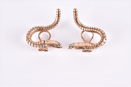 Lot 599 - An unusual pair of snake earrings of swirled...