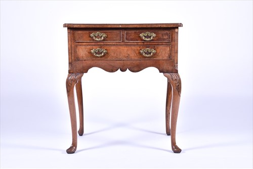 Lot 4 - A Queen Anne walnut lowboy with quarter...