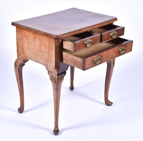 Lot 4 - A Queen Anne walnut lowboy with quarter...