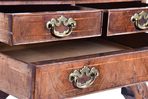 Lot 4 - A Queen Anne walnut lowboy with quarter...
