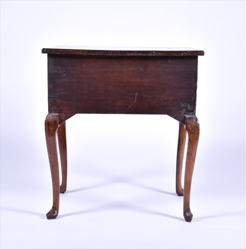 Lot 4 - A Queen Anne walnut lowboy with quarter...