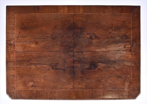Lot 4 - A Queen Anne walnut lowboy with quarter...
