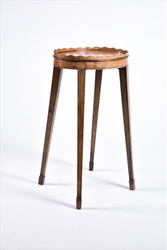 Lot 61 - A small George III oval wine table with wave...