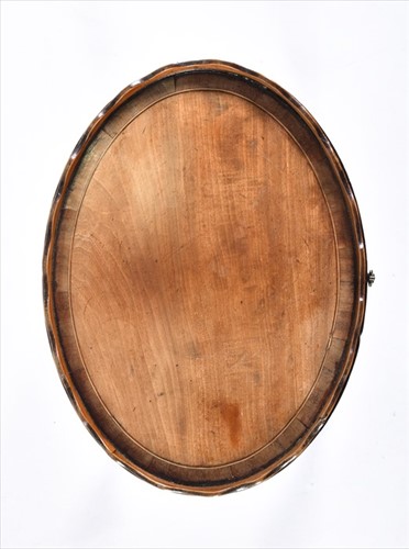 Lot 61 - A small George III oval wine table with wave...