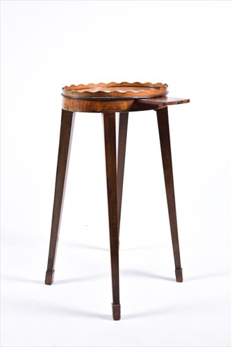 Lot 61 - A small George III oval wine table with wave...