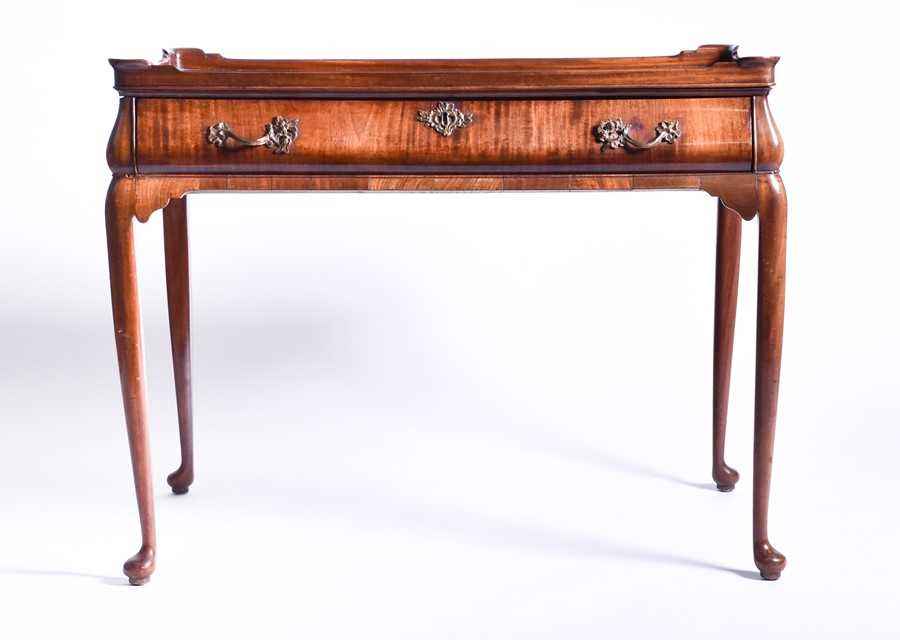 Lot 5 - A Georgian mahogany veneer silver table the...
