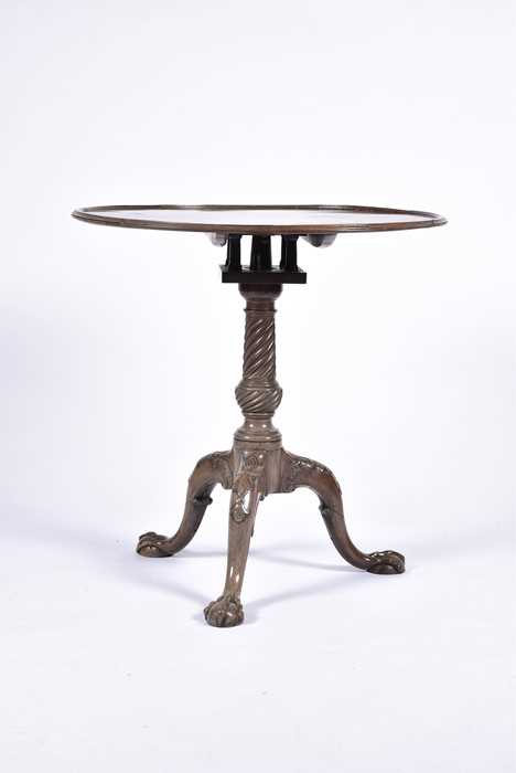 Lot 55 - A Georgian mahogany tilt-top table with...