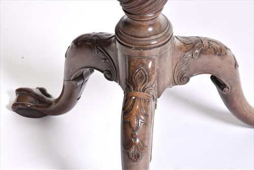Lot 55 - A Georgian mahogany tilt-top table with...