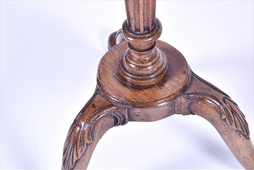 Lot 57 - A Victorian carved mahogany tripod side table...