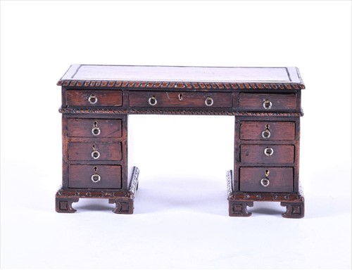 Lot 391 - An antique miniature doll house model of a...