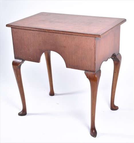 Lot 58 - A reproduction burr walnut lowboy the...