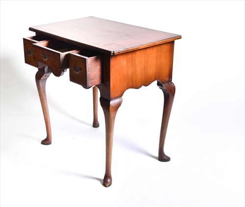 Lot 58 - A reproduction burr walnut lowboy the...
