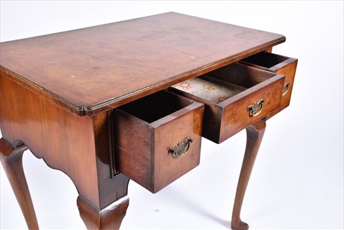 Lot 58 - A reproduction burr walnut lowboy the...