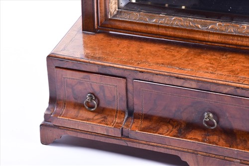 Lot 45 - A Queen Anne burr walnut dressing mirror the...