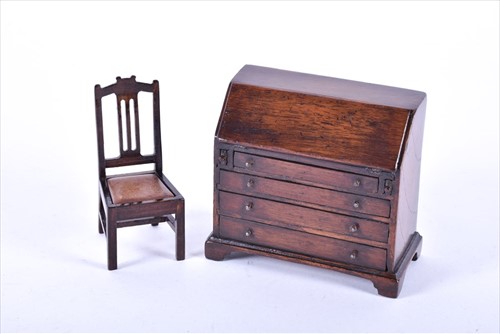 Lot 397 - A miniature antique doll house Georgian bureau...