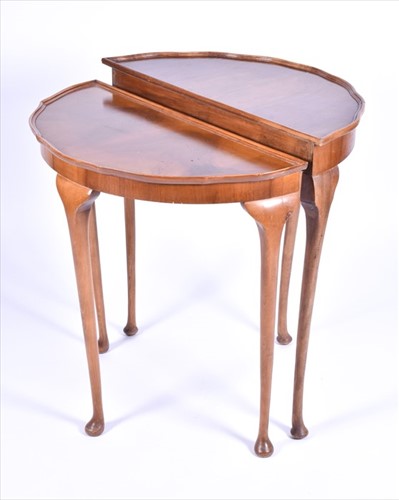 Lot 47 - A burr walnut quarter veneered nest of tables...