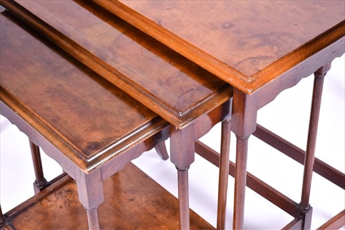 Lot 47 - A burr walnut quarter veneered nest of tables...