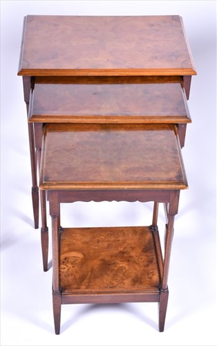 Lot 47 - A burr walnut quarter veneered nest of tables...