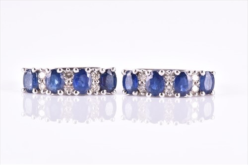Lot 575 - A pair of 9ct white gold, diamond, and...